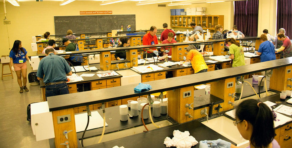 lab benches with about 20 people completing an experiment 