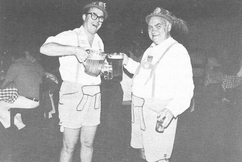 Two men in drinking beer at Oktoberfest